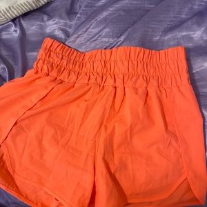 They are more of a coral color than orange! The lighting made a huge difference!